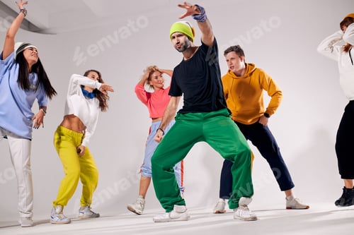 Preview: Portrait of cheerful girls and guys dancing at party