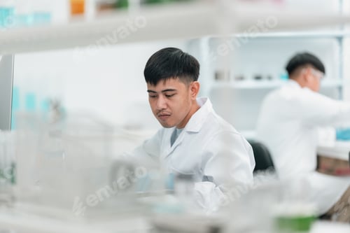 Preview: Research team working in medical science laboratory to develop innovative cosmetic products