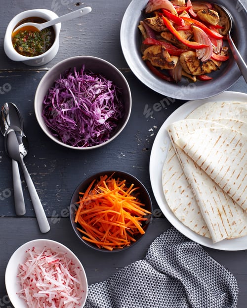 Preview: Fresh ingredients for a taco meal spread out on a table