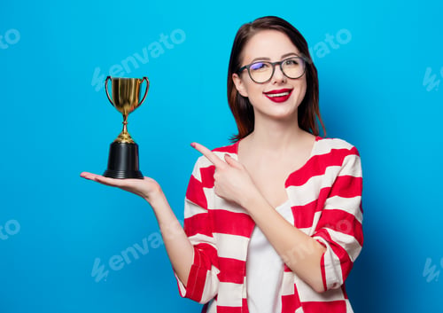 Preview: young smiling woman with cup trophy