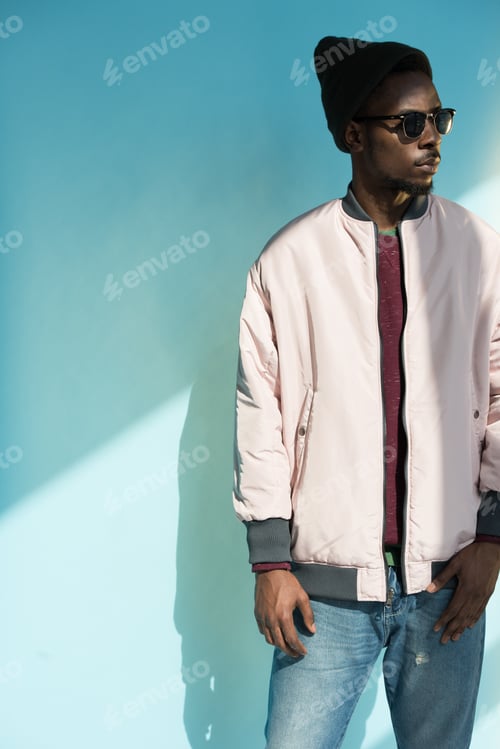 Preview: Stylish Young Man Wearing Sunglasses and Pink Jacket