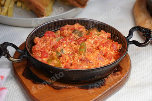 Preview: Turkish Menemen omelet in a frying pan. .