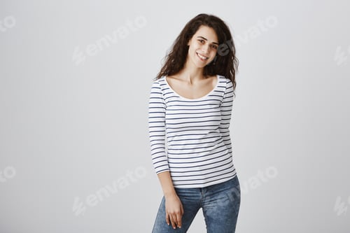 Preview: Attractive young girl with lot of dreams and life goals. Studio shot of beautiful curly-haired
