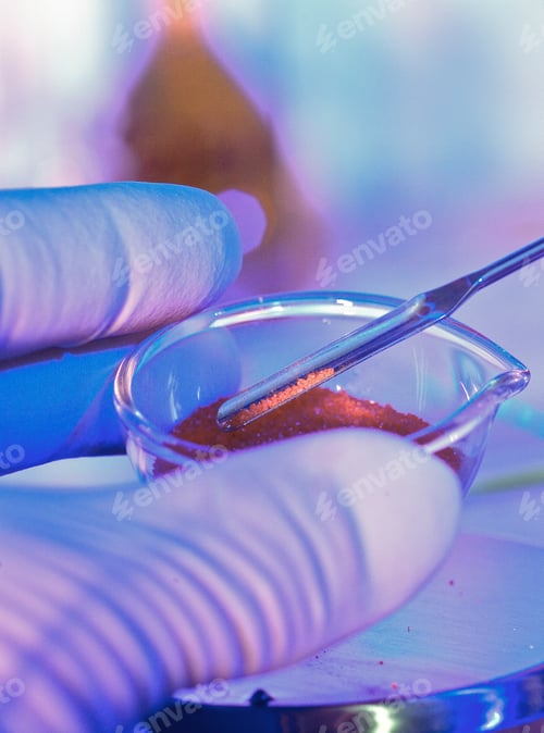 Preview: Scientist's hand manipulating samples in a petri dish under neon light