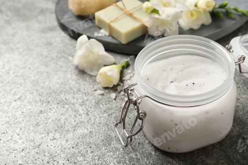 Preview: Body scrub in glass jar on grey table, space for text