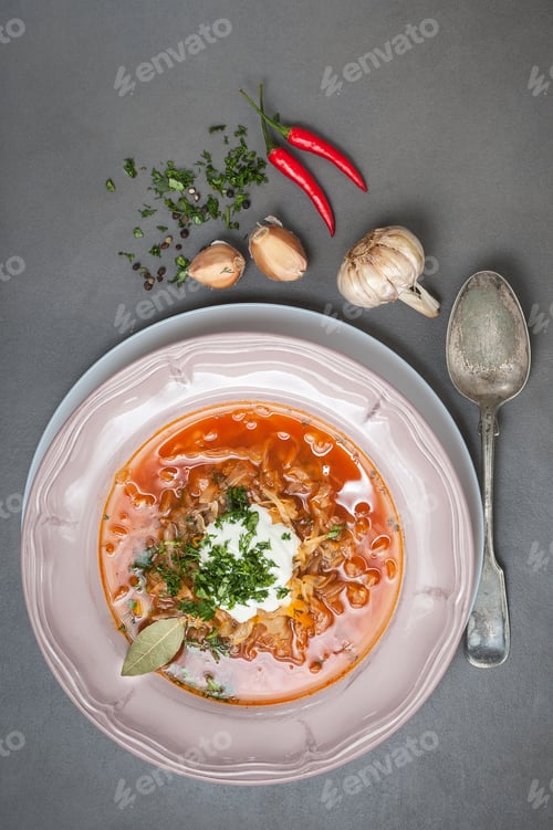 Preview: Overhead View of Hearty Soup with Peppers and Garlic