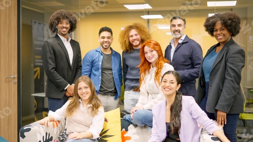 Preview: Multi-ethnic team of coworkers smiling at camera