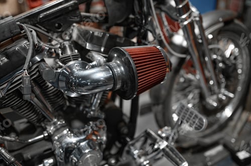 Preview: Closeup motorcycle to be repaired in mechanic workshop