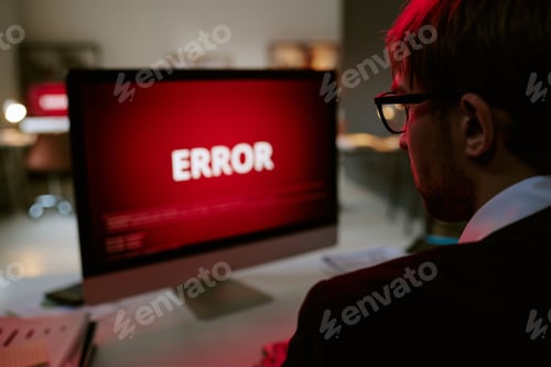 Preview: Caucasian Young Adult Man Facing Computer Screen Displaying Error Message