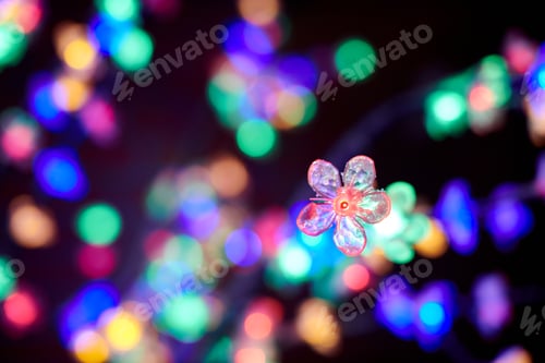 Preview: Colorful lights bokeh from decorative luminous flowers garlands at holiday, multicolored lights