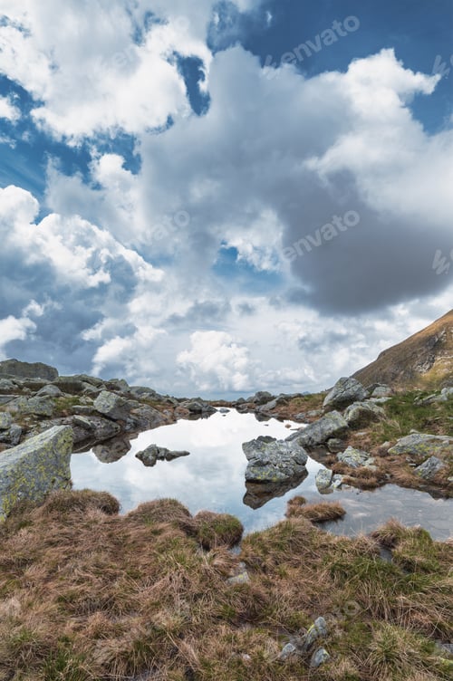 Preview: Vertical mountain landscape with small lake