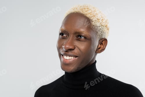 Preview: portrait of happy african american man with heterochromia isolated on grey