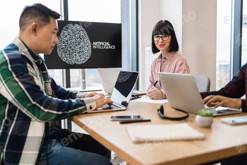 Preview: IT experts working on artificial intelligence development in modern office