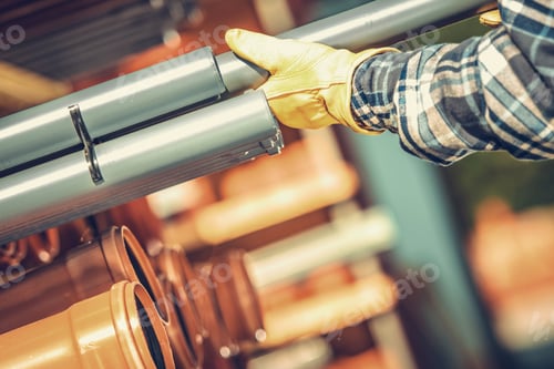 Preview: Construction Worker Choosing Right Plastic Pipes