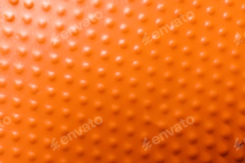 Preview: Texture of orange plastic cup as background, closeup
