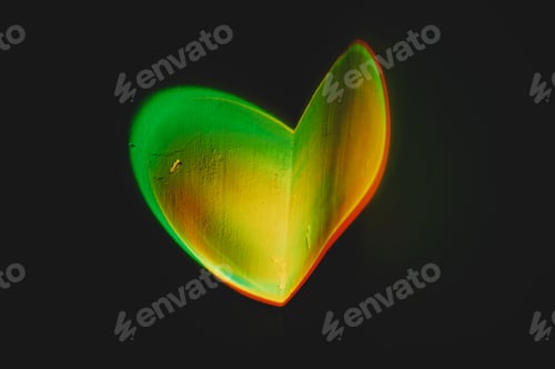 Preview: Colorful light heart shape projected in a wall