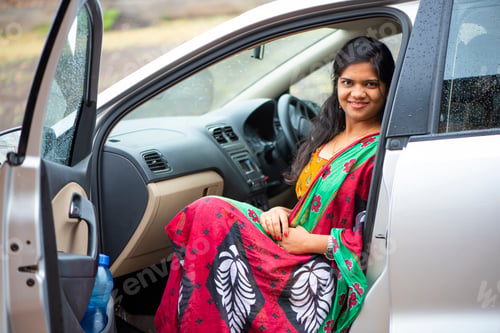 Preview: Portrait of Indian woman sitting in a car