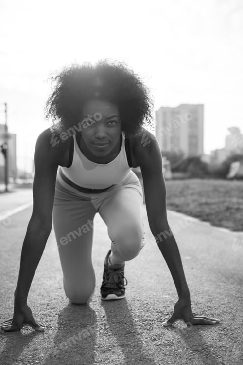 Preview: Portrait of sporty young african american woman running outdoors