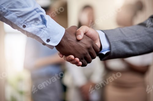 Preview: Together well do great things. Shot of two businessmen shaking hands in greeting.