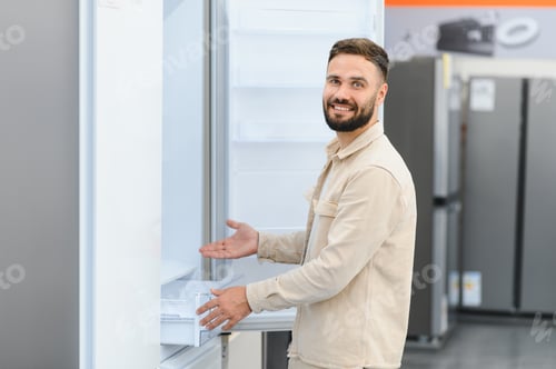 Preview: Customer choosing new refrigerator in electronics store