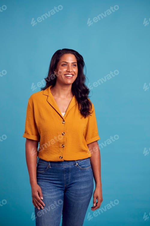 Preview: Portrait Of Mature Female Model Posing For Photographer Against Background On Studio Fashion Shoot