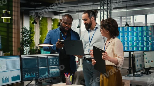 Preview: Diverse group of employees collaborate on project planning and analysis