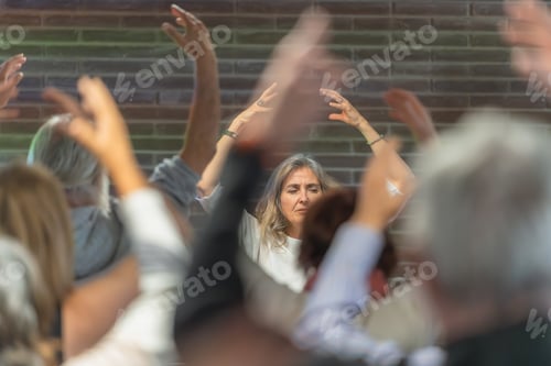 Preview: Elderly woman doing meditation classes at alternative medicine center