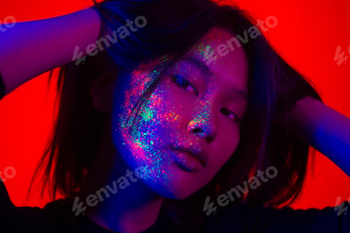 Preview: Fashion model with fluo painting on the face