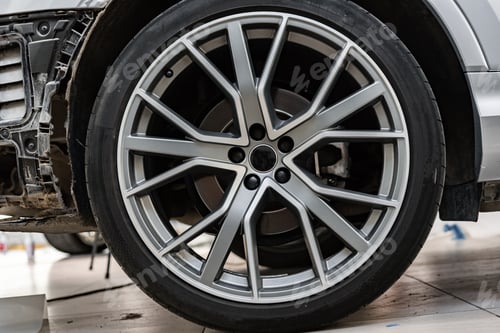 Preview: Close up view of a wheel of luxury car.