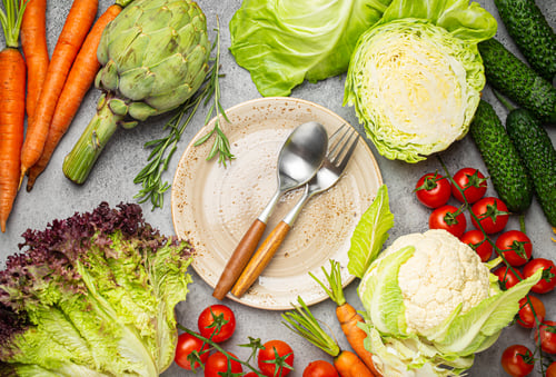 Preview: Assorted food raw products: vegetables, beef meat, fish salmon and empty plate in centre, light