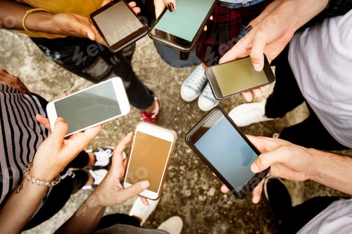 Preview: Young adults using smartphones in a circle social media and conn