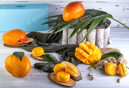 Preview: Assorted natural foods like mangoes and macarons displayed on a table