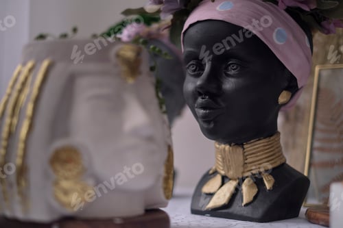 Preview: African American Woman bust. pots for flowers in the form of a woman's head. soft focus