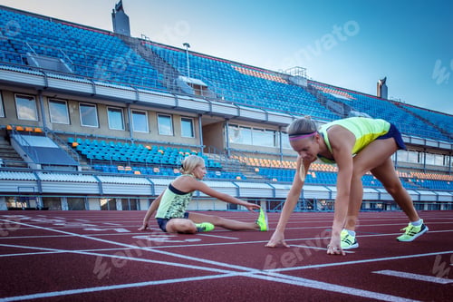 Preview: Two female sprinter athlete in the athletics stadium.
