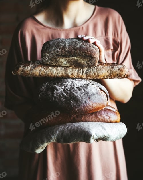 Preview: Fresh bread in the hands of a baker. Food, baking