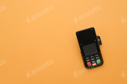 Preview: Modern payment terminal on yellow background. Modern payment systems concept