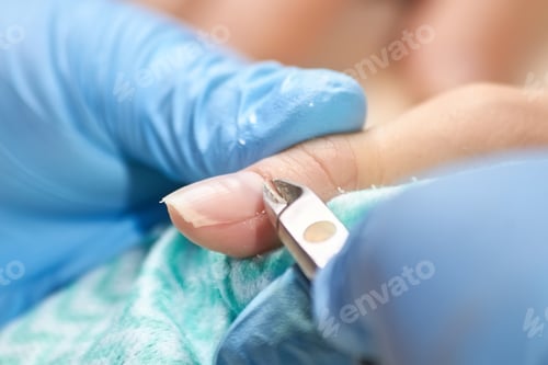 Preview: Manicurist cut the cuticle to the client