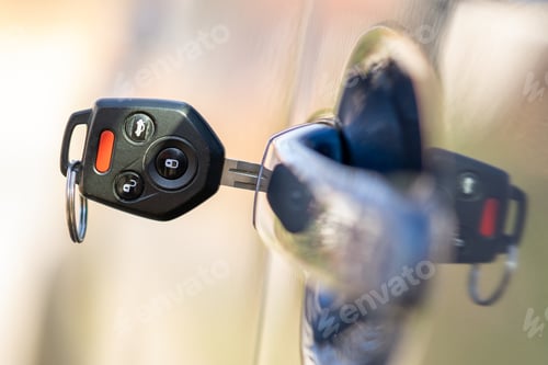Preview: Close up of car door with key sticking out of the lock. Concept of process opening or closing