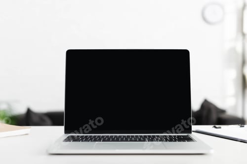 Preview: close up of laptop with blank screen in office