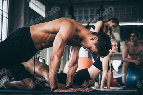 Preview: Strong man exercising in the sport gym