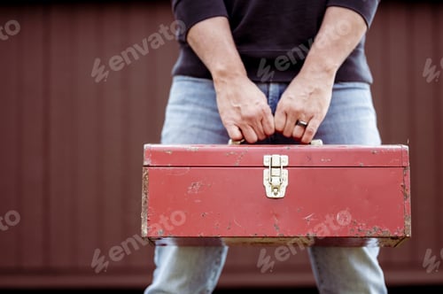 Preview: Closeup shot of a technician holding a toolbox