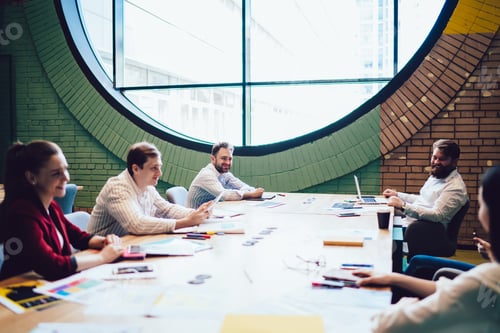 Preview: Young colleagues sitting at business meeting