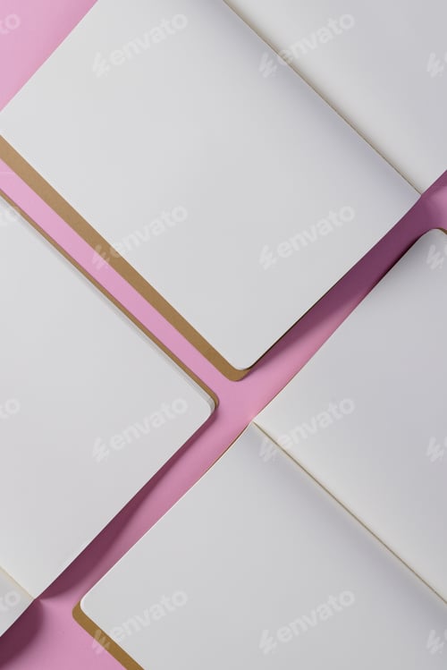Preview: Close up of open books with copy space on pink background