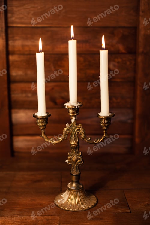 Preview: Halloween still life with burning candle on witch book and magic objects