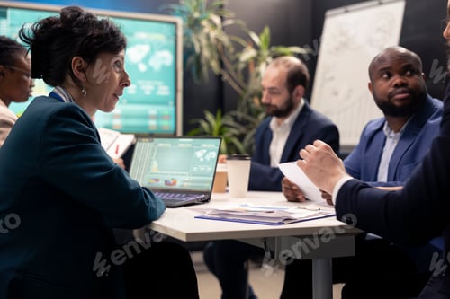 Preview: Team of business associates debating ways to increase profit
