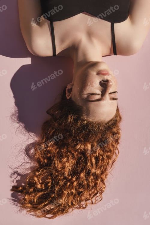 Preview: Curly ginger girl upside down.