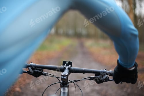 Preview: Close up of cyclist and handlebars of bike