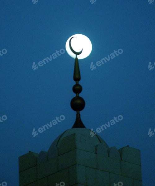 Preview: Mosque minaret in dark night moonlight
