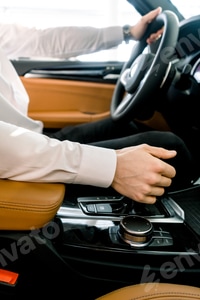 Preview: Man changing gears in a luxurious car