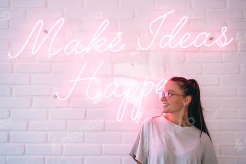 Preview: Cheerful teenager near font neon message